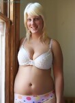 Chubby blonde amateur showing off her big tits