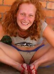 Freckled redhead hottie with big tits rubbing her pussy