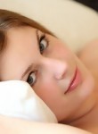 Beautiful busty teen Danielle posing in her bed