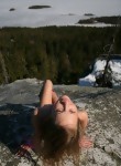Cute teen Masha posing on a mountain