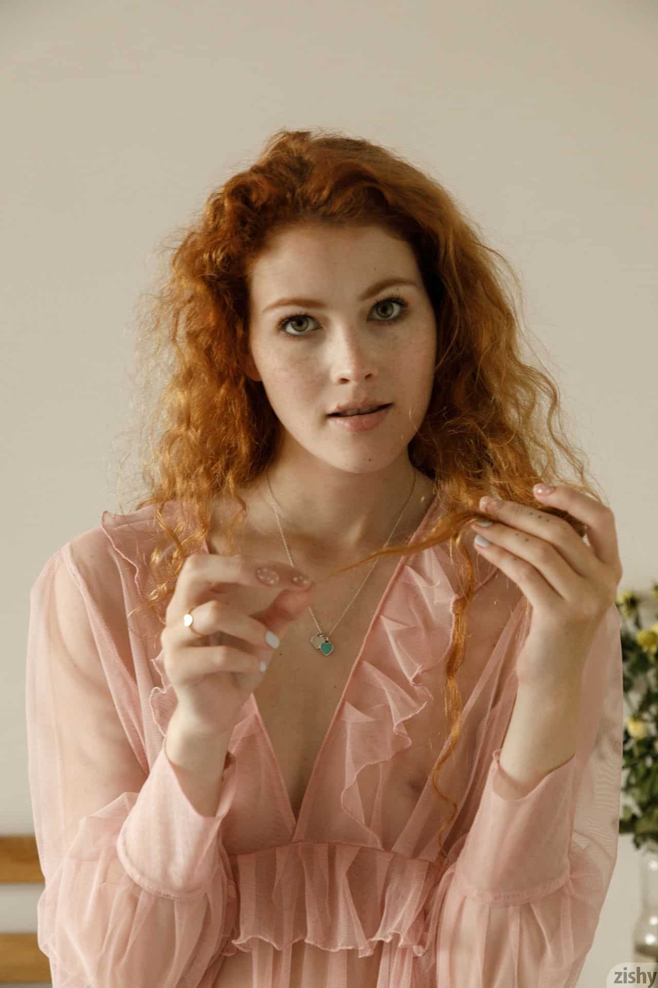 Freckled redhead Heidi Romanova in a pink see-through top