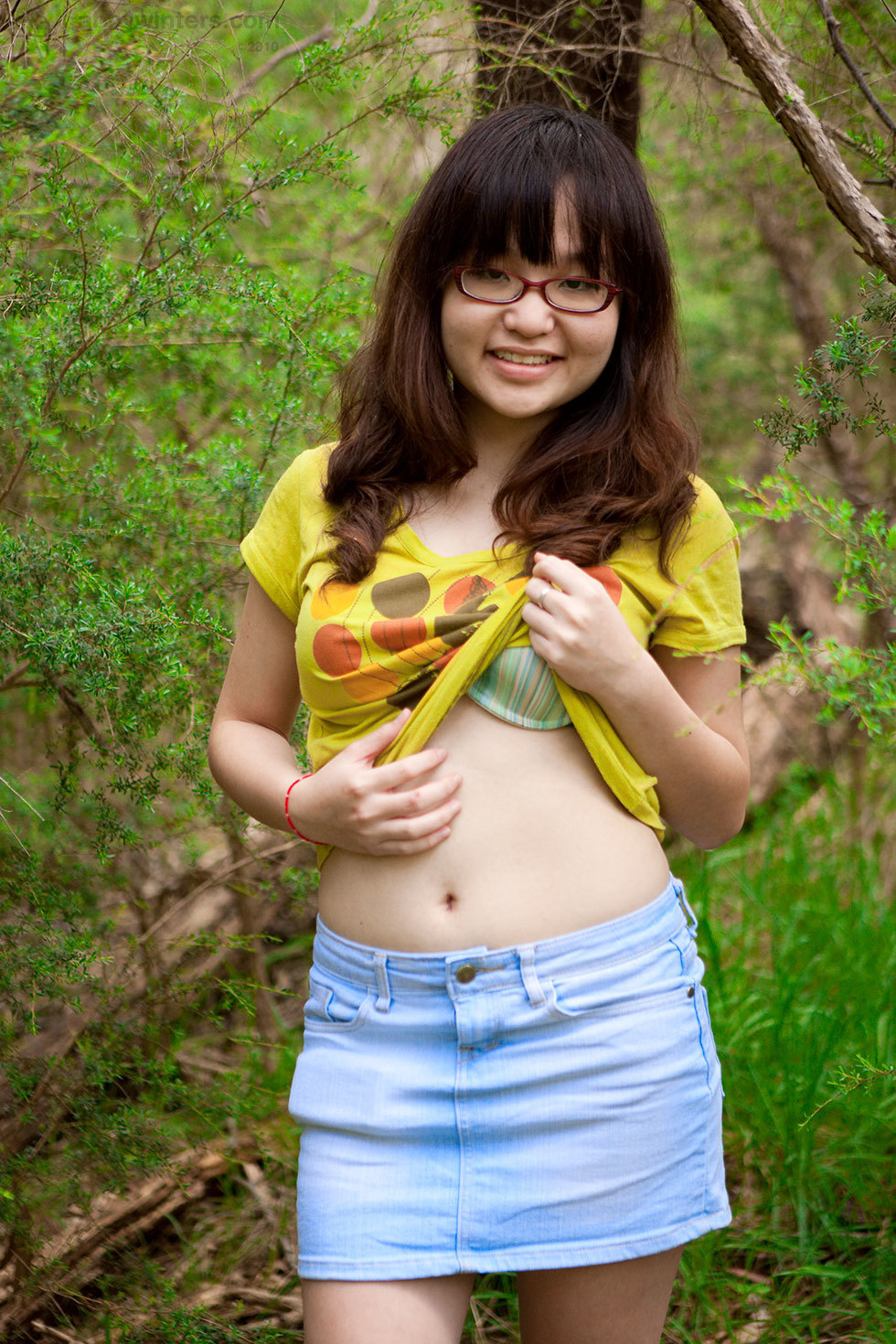Nerdy Asian girl shows off her bush in a forest at Brdteengal pic photo picture