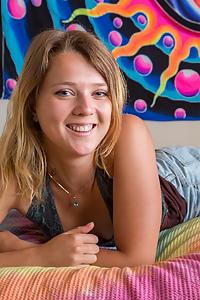 Cute blonde amateur pulls off her jean shorts in bed