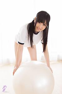 Cute Japanese teen teasing on an exercise ball