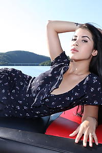 Black-haired babe spreading on a boat
