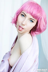 Pink-haired teen shows off her shaved pussy