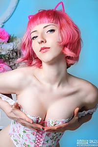 Pink-haired cutie shows off her shaved pussy