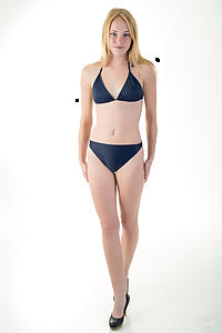 Freckled blonde teen cutie takes off her bikini