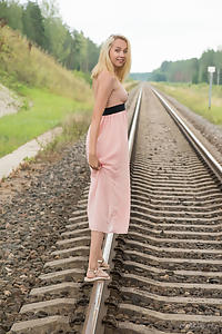 Sexy blonde teen nude on train tracks