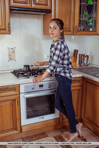 Skinny brunette teen spreading in the kitchen
