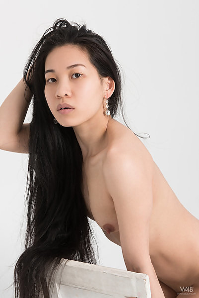 Long-haired Asian shows off her long nipples