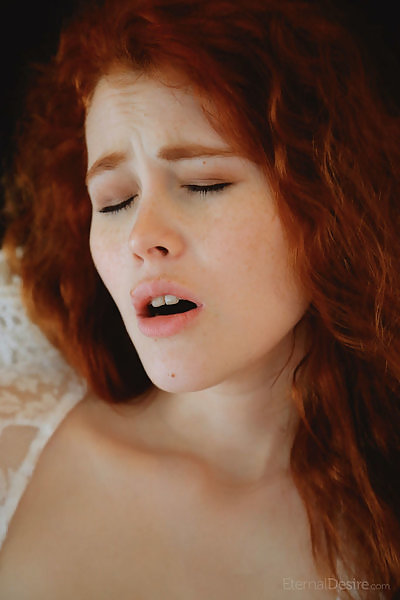 Redhead babe in a see-through night gown masturbating