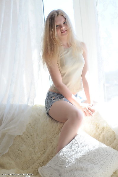Cute blonde teen with pale skin takes off her jean shorts