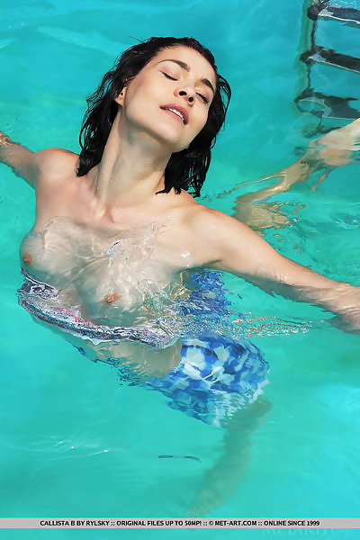 Black-haired girl shows off her meaty lips by the pool