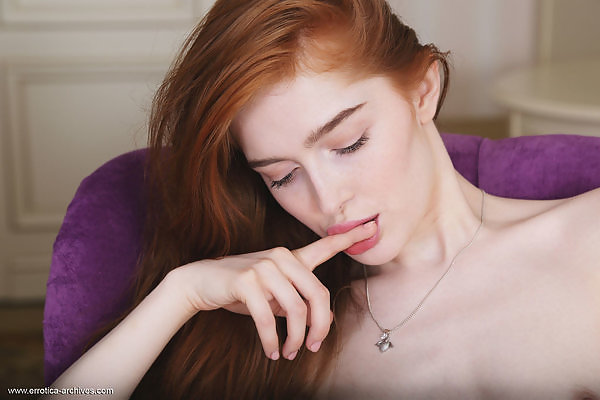 Flat-chested redhead with pale skin masturbating