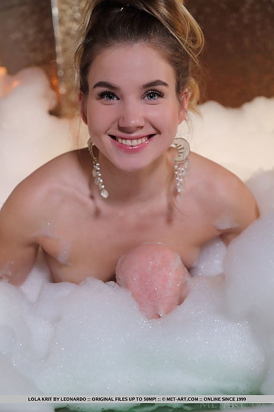 Flat-chested blonde teen Lola Krit bathing