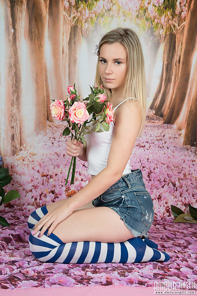 Blonde teen in striped socks takes off her jean shorts