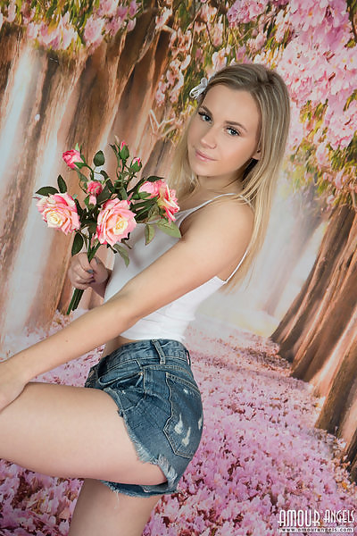Blonde teen in striped socks takes off her jean shorts