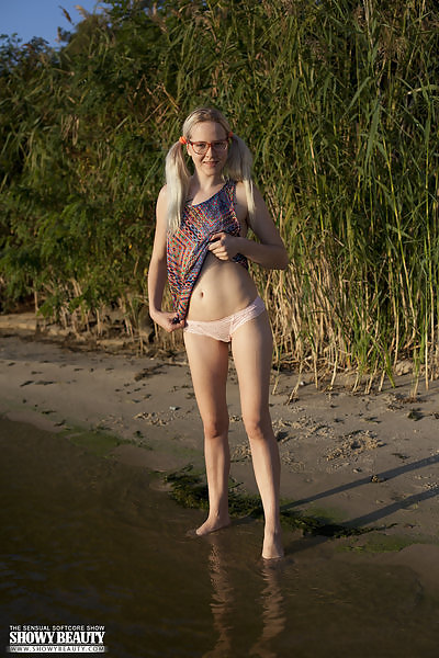 Nerdy blonde teen nude in a lake