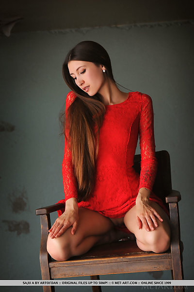 Shaved brunette with long hair lifts up her dress