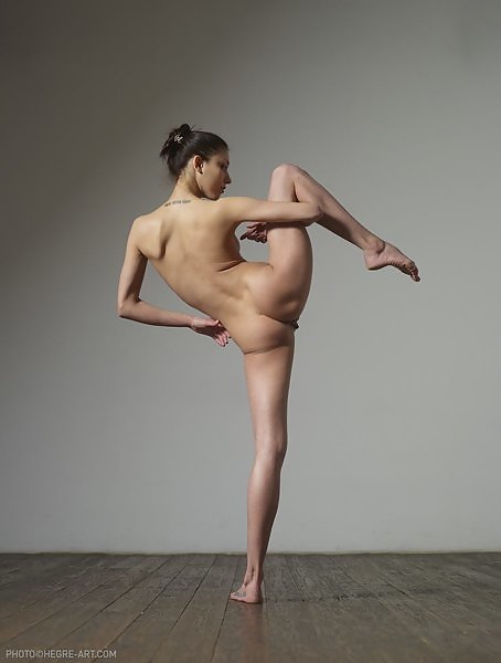 Brunette ballerina shows off how flexible she is