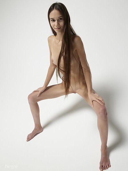 Flexible teen goddess spreading in studio