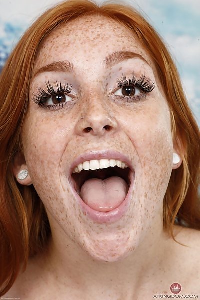 Freckled redhead gapes her asshole