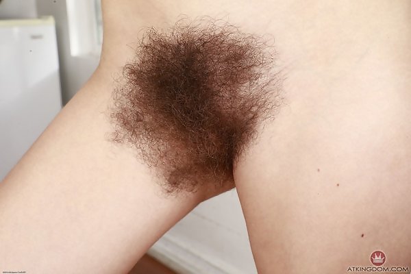 Hairy amateur spreads her thick hairy bush to take a piss