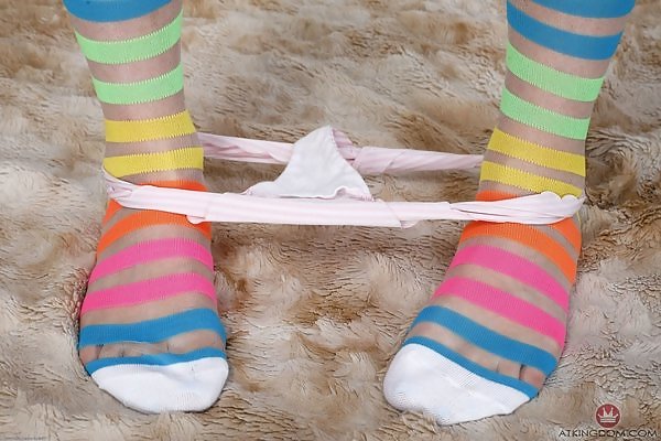 Tattooed blonde in striped socks spreads her holes