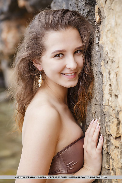 Cute brunette teen nude by a cliff