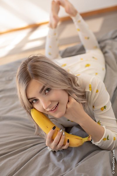 Stunning busty teen sucking a banana