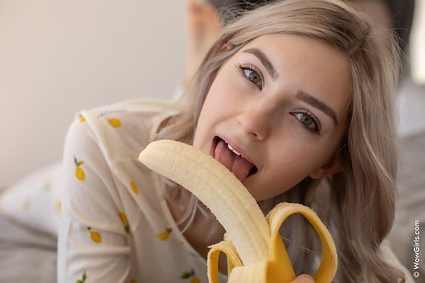 Stunning busty teen sucking a banana