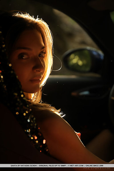 Sexy blonde stripping in her car
