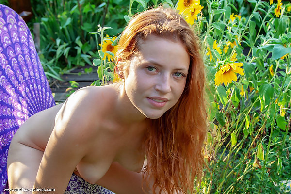 Redhead amateur nude in the garden