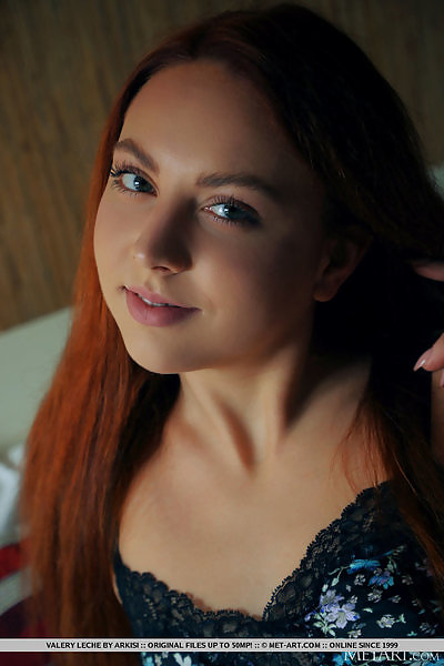 Flat-chested redhead spreads her holes in bed