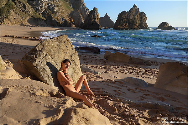 Skinny brunette teen nude at the beach