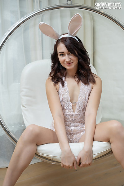 Brunette bunny nude in a chair

