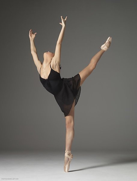 Flexible black-haired ballerina posing and dancing