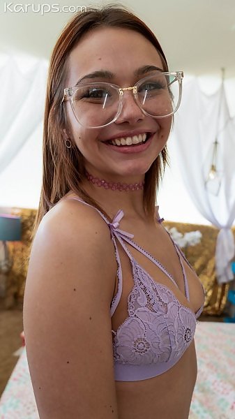 Cute nerdy girl spreads her ass in bed