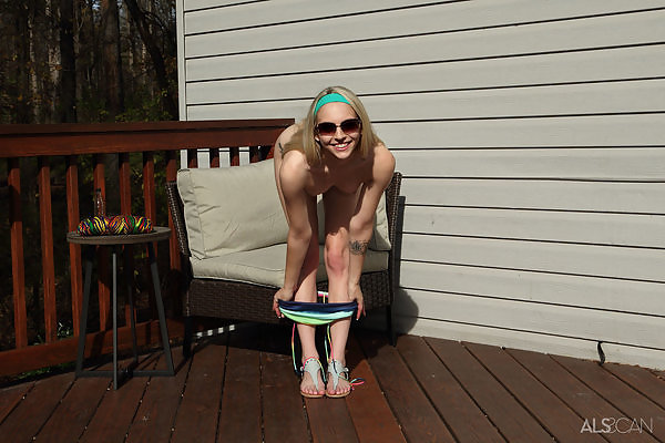 Pale blonde cutie toying on the terrace