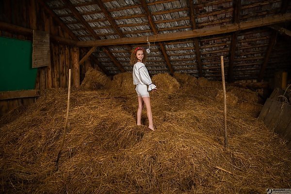 Cute girl spreads her tight ass in a barn