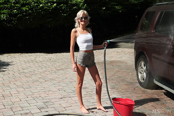 Skinny blonde spreading and toying while washing a car