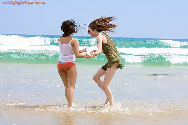 Cute lesbians fooling around in the sea
