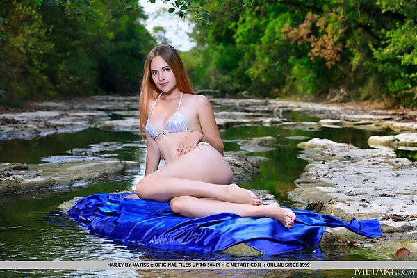 Shaved blonde spreading by a river