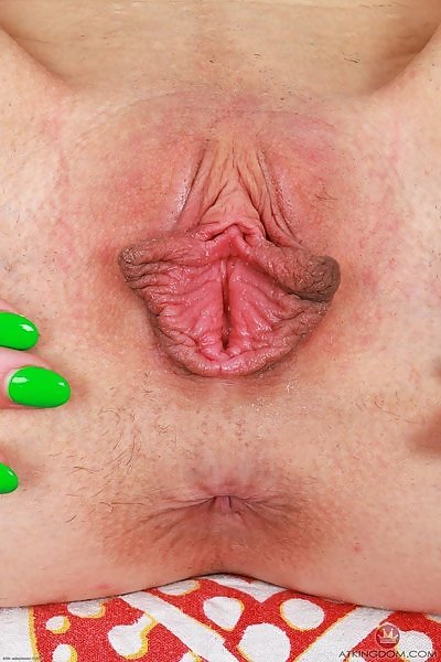 Brunette amateur spreads her huge pussy lips