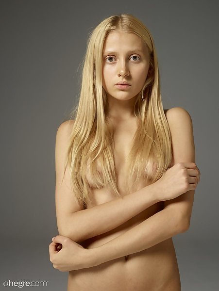 Cute blonde girl nude in studio