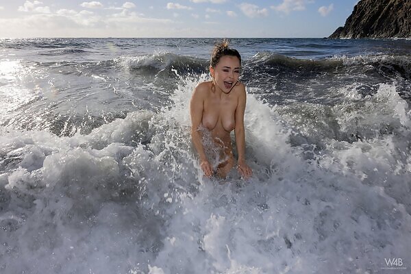 Shaved brunette with saucer nipples nude in the sea from Watch 4 Beauty - 13/17