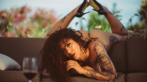 Cover featuring MIYUMIYU in Alchemy Of Red from Suicide Girls