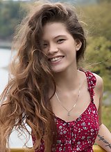 Long-haired teen lifts up her dress in public