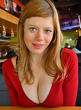 Freckled redhead teen shows off her cleavage